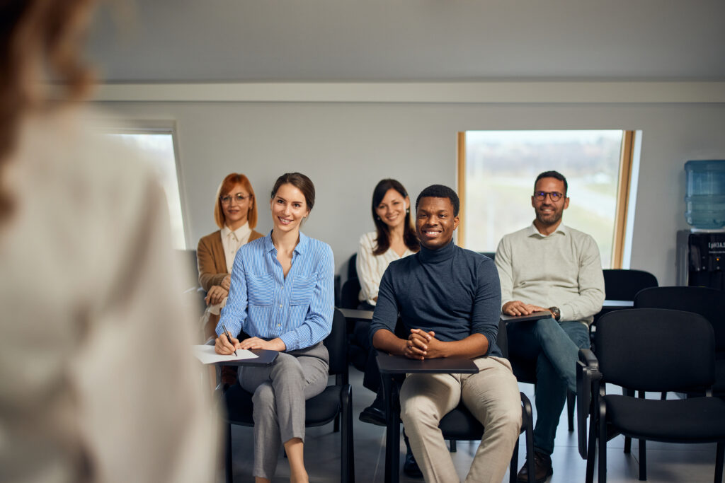 Professionals attending a workshop for professional development.